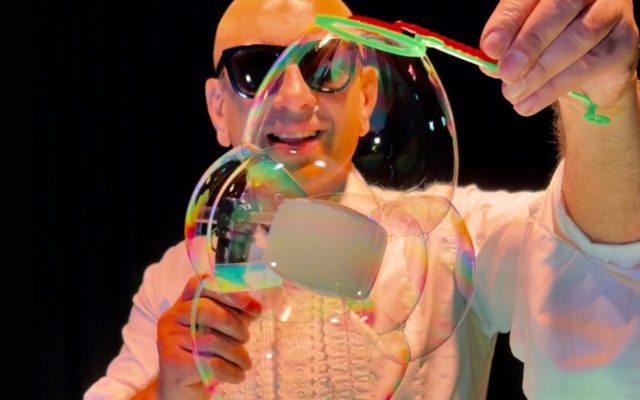 A man holding a bubble